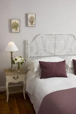 a bedroom with a bed and a table with a lamp at DD Luxury House in Rome