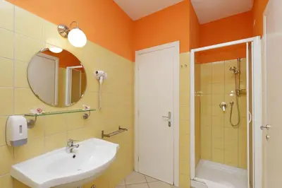 a bathroom with a sink and a shower and a mirror at Affittacamere Alessia&Calliope in Rome