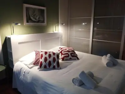 a bedroom with a bed with towels on it at Boschetto Monti Apartment in Rome