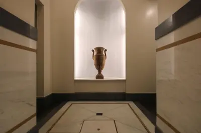 a vase sitting on a shelf in a room at Boschetto Monti Apartment in Rome