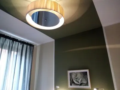 a light hanging from a ceiling in a room at Boschetto Monti Apartment in Rome