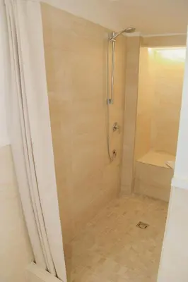 a shower with a glass door in a bathroom at DOMUS DIVI - appartamento nel cuore di Roma in Rome