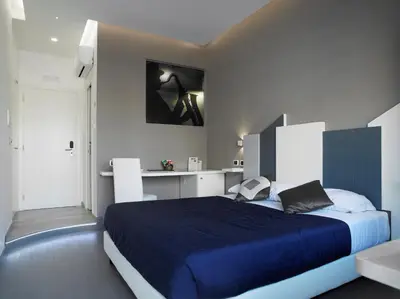 a bedroom with a large blue bed in a room at Jazz Style in Rome