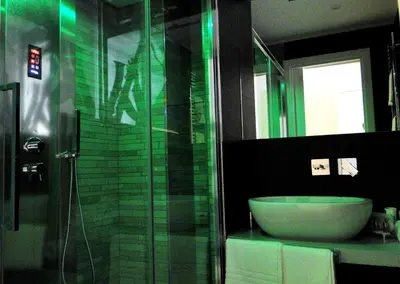 a bathroom with a sink and a glass shower at Jazz Style in Rome