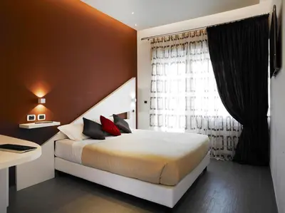 a bedroom with a large bed and a window at Jazz Style in Rome