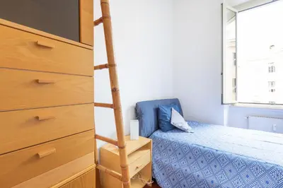 a bedroom with a bunk bed and a ladder at Like At Home Piramide in Rome