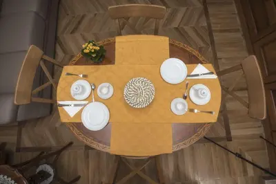 an overhead view of a table with white dishes on it at Bed & Breakfast Vacanze Romane in Rome