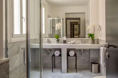 a bathroom with a sink and a mirror at Nazionale 51 L Rooms in Rome