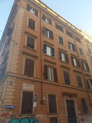 a tall building with many windows on a street at guesthouse ava roma in Rome