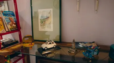 a glass table with a toy car on top of it at Casa Particular 25Rooms in Rome