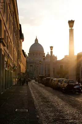 a city street with a building and a cathedral at Rome Services Porta Castello in Rome