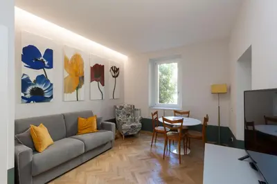 a living room with a couch and a table at Donatello Loft in Rome