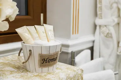 a container of toilet paper sitting on a table at THE IMPERIAL SUITE e THE BRICKS in Rome