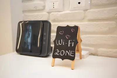 a chalkboard sign with the words wait it done next to a tv at B & Bea in Rome