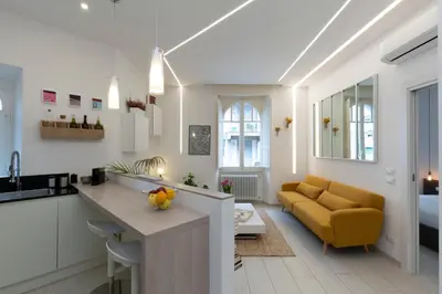 a kitchen and living room with a yellow couch at B & Bea in Rome