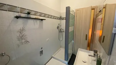 a bathroom with a sink and a shower and a toilet at La Dimora in Rome