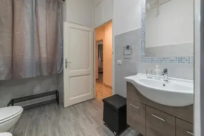 a bathroom with a sink and a toilet at GuestHost - Ad un passo da Villa Borghese Apartment in Rome
