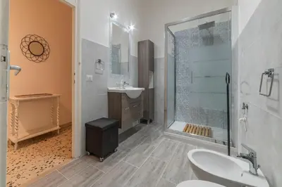 a bathroom with a shower toilet and a sink at GuestHost - Ad un passo da Villa Borghese Apartment in Rome