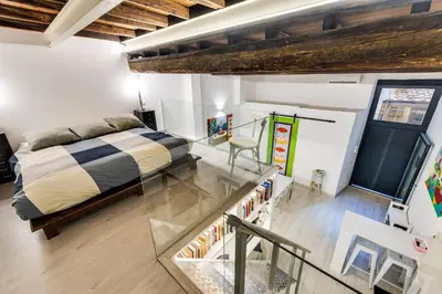 a bedroom with a bed and a glass floor at Rome Historic Center LOFT in Rome