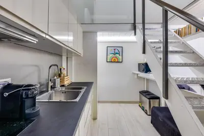 a kitchen with a sink and a counter top at Rome Historic Center LOFT in Rome