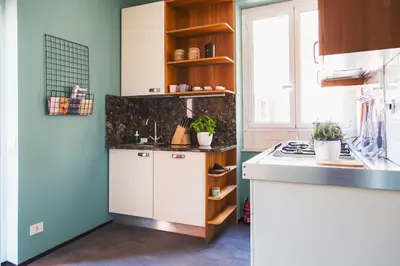 a kitchen with a sink and a counter top at TrastevereHome - Santa Cecilia in Trastevere with Balcony in Rome