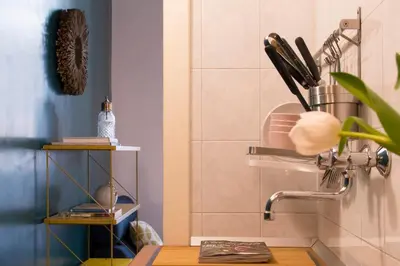 a dining room with a table and chairs at TrastevereHome - Central Monserrato House with Balcony in Rome