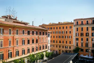 a group of buildings next to each other at TrastevereHome - San Cosimato View on Trastevere Square in Rome