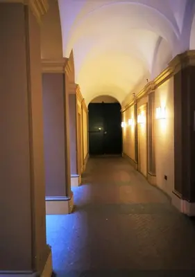 an empty hallway with a black door in a building at Trevi Nice Holiday - Luxury Apartment in Rome