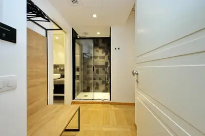 a hallway with a door leading to a bathroom at Youroom Vite in Rome