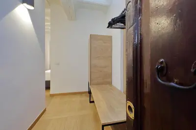a wooden door in a room with a hallway at Youroom Vite in Rome