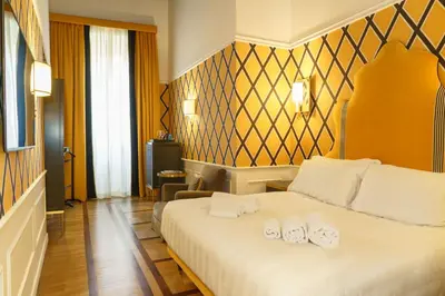 a hotel room with a bed with towels on it at Il Campo Marzio in Rome