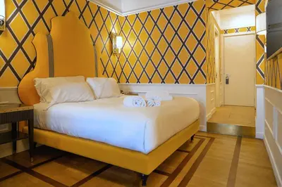 a bedroom with a bed with towels on it at Il Campo Marzio in Rome