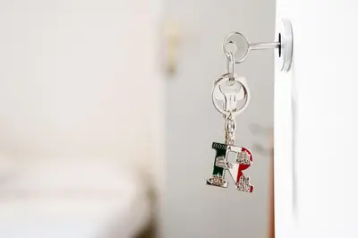 a pair of keys hanging from a door handle at Da Fede in Rome