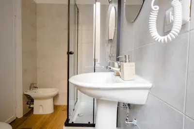 a bathroom with a sink and a shower at Da Fede in Rome