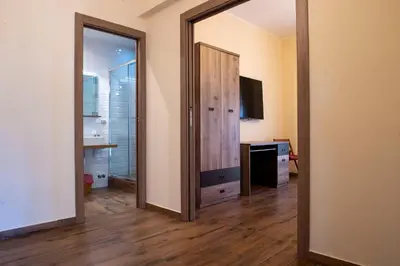 a room with a mirror and a dresser and a door at JSK Suite in Rome
