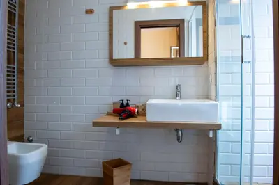 a bathroom with a sink and a mirror at JSK Suite in Rome