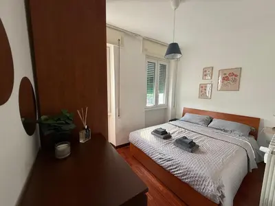 a bedroom with a bed and a table in it at Home of Joy - Vatican in Rome