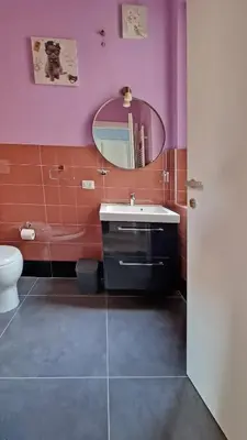 a bathroom with a sink and a mirror at GuestHouse Martin in Rome