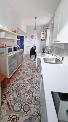 a kitchen with a sink and a counter top at GuestHouse Martin in Rome
