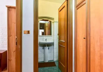 a bathroom with a sink and a mirror at Center Rome Termini Rooms & Apartment Sale in Rome