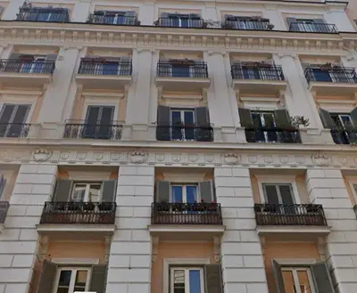 a tall building with windows and balconies at Center Rome Termini Rooms & Apartment Sale in Rome