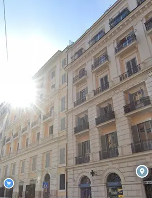 a large building with balconies on the side of it at Center Rome Termini Rooms & Apartment Sale in Rome
