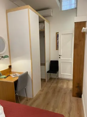 a room with a desk and a chair and a door at Elian Apartament In The Center of Rome in Rome