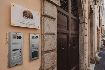 a sign on the side of a building next to a door at Vicario Suites in Rome
