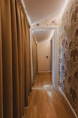 a hallway with brown curtains in a room at Vicario Suites in Rome