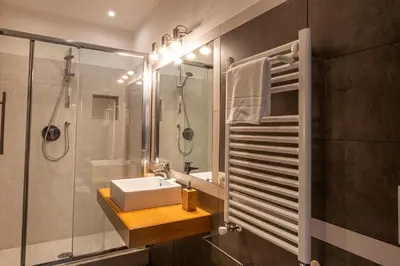 a bathroom with a sink and a shower at Appartamento Margherita 2 in Rome