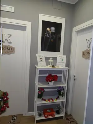 a white book shelf in a room with two doors at Home K&Y - Aurelio in Rome