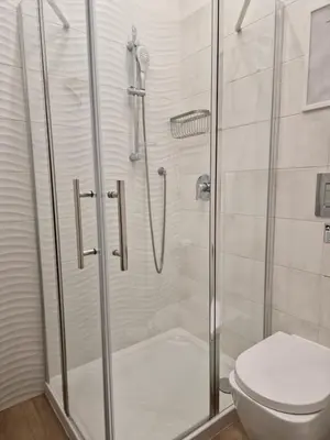 a bathroom with a shower and a toilet at Home K&Y - Aurelio in Rome