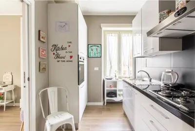 a kitchen with a sink and a stove top oven at Home K&Y - Aurelio in Rome