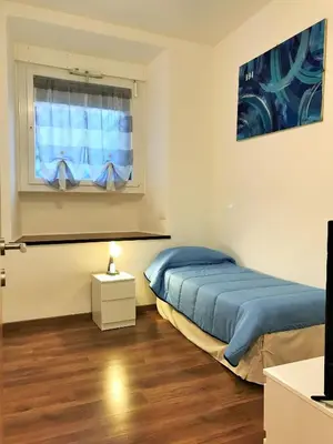 a bedroom with a bed and a window at Trastevere Sweet Home in Rome
